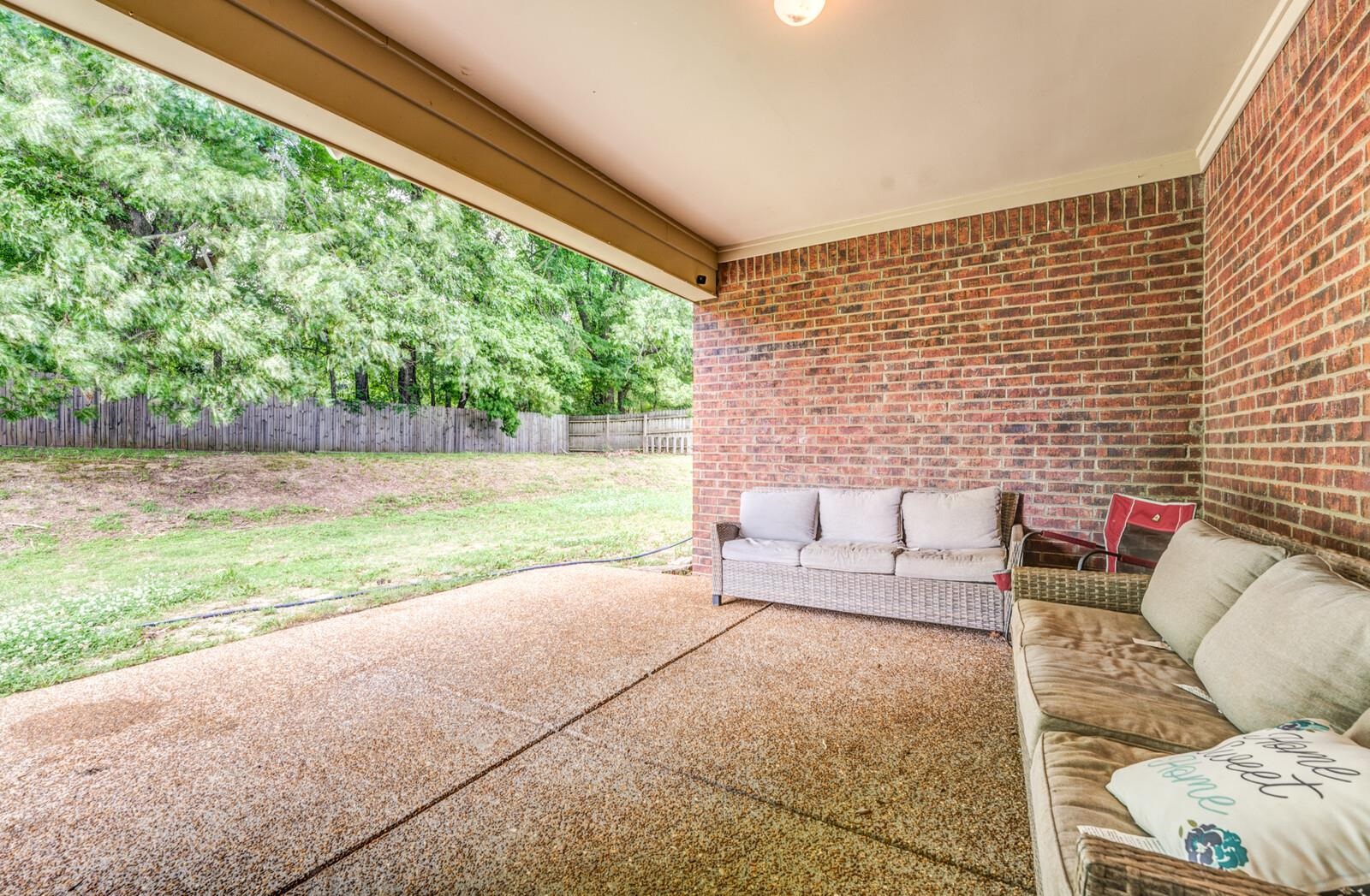 4671 Hampton Ridge Lane Bartlett, TN 38002 - Photo 31 of 40 Covered patio with an exposed aggregate concrete surface