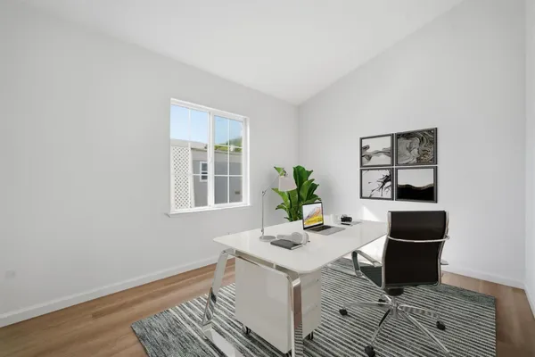 a workspace with furniture and window