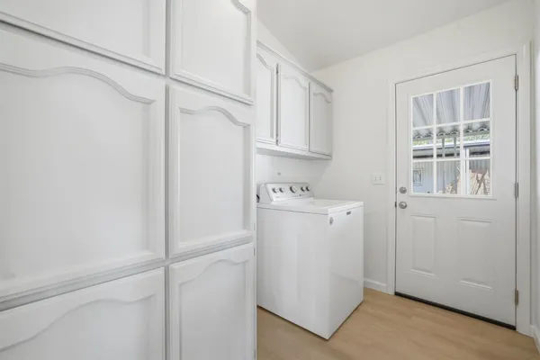 a view of a storage & utility room with closet dryer