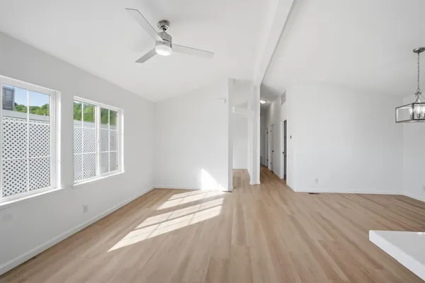 wooden floor in an empty room with a window