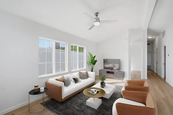 a living room with furniture and a large window