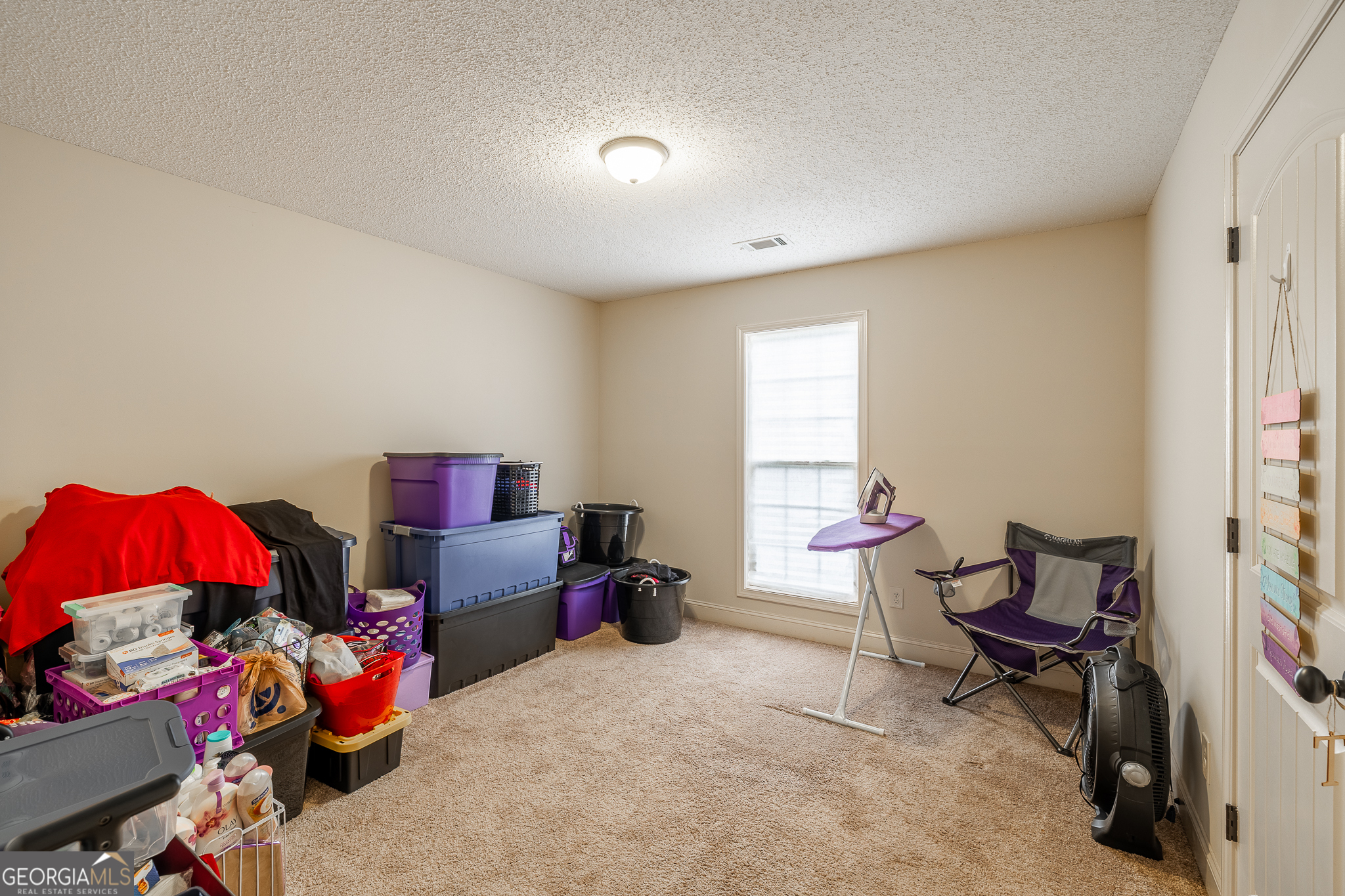 105 Stonebrooke Drive Colbert, GA 30628 - Photo 11 of 26 a bedroom with furniture and a window