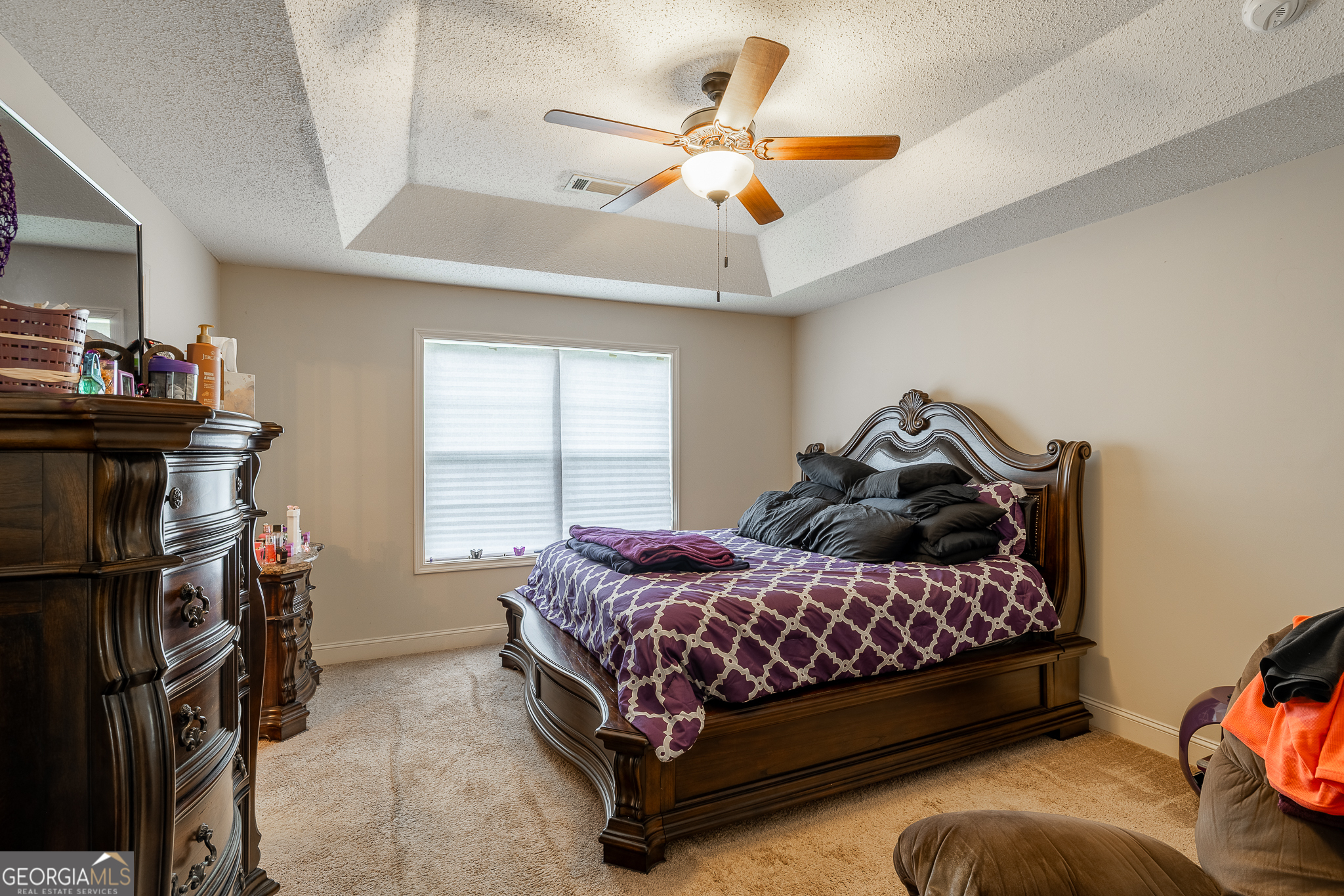 105 Stonebrooke Drive Colbert, GA 30628 - Photo 12 of 26 a bedroom with a bed and a ceiling fan
