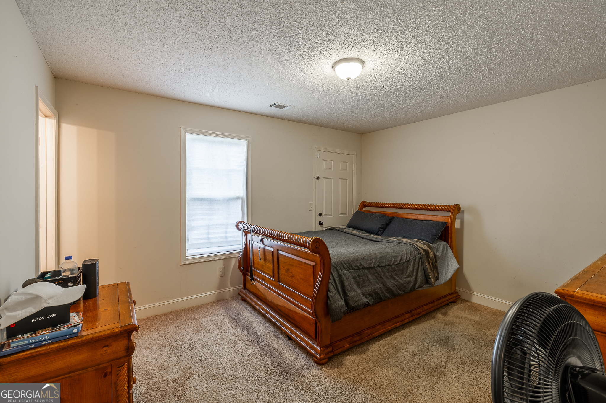 105 Stonebrooke Drive Colbert, GA 30628 - Photo 17 of 26 a bed room with a bed and a window
