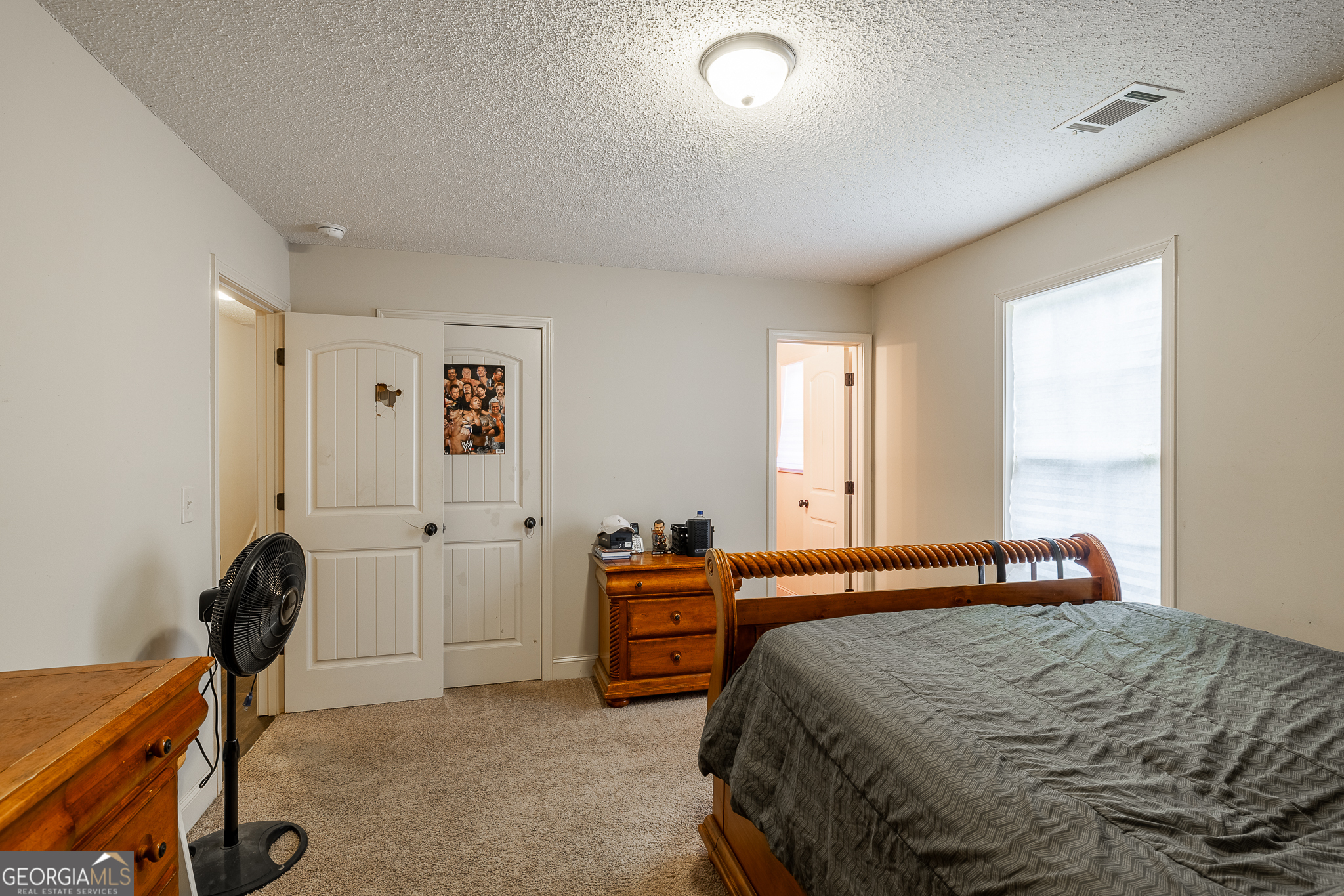 105 Stonebrooke Drive Colbert, GA 30628 - Photo 18 of 26 a bedroom with a bed and a window