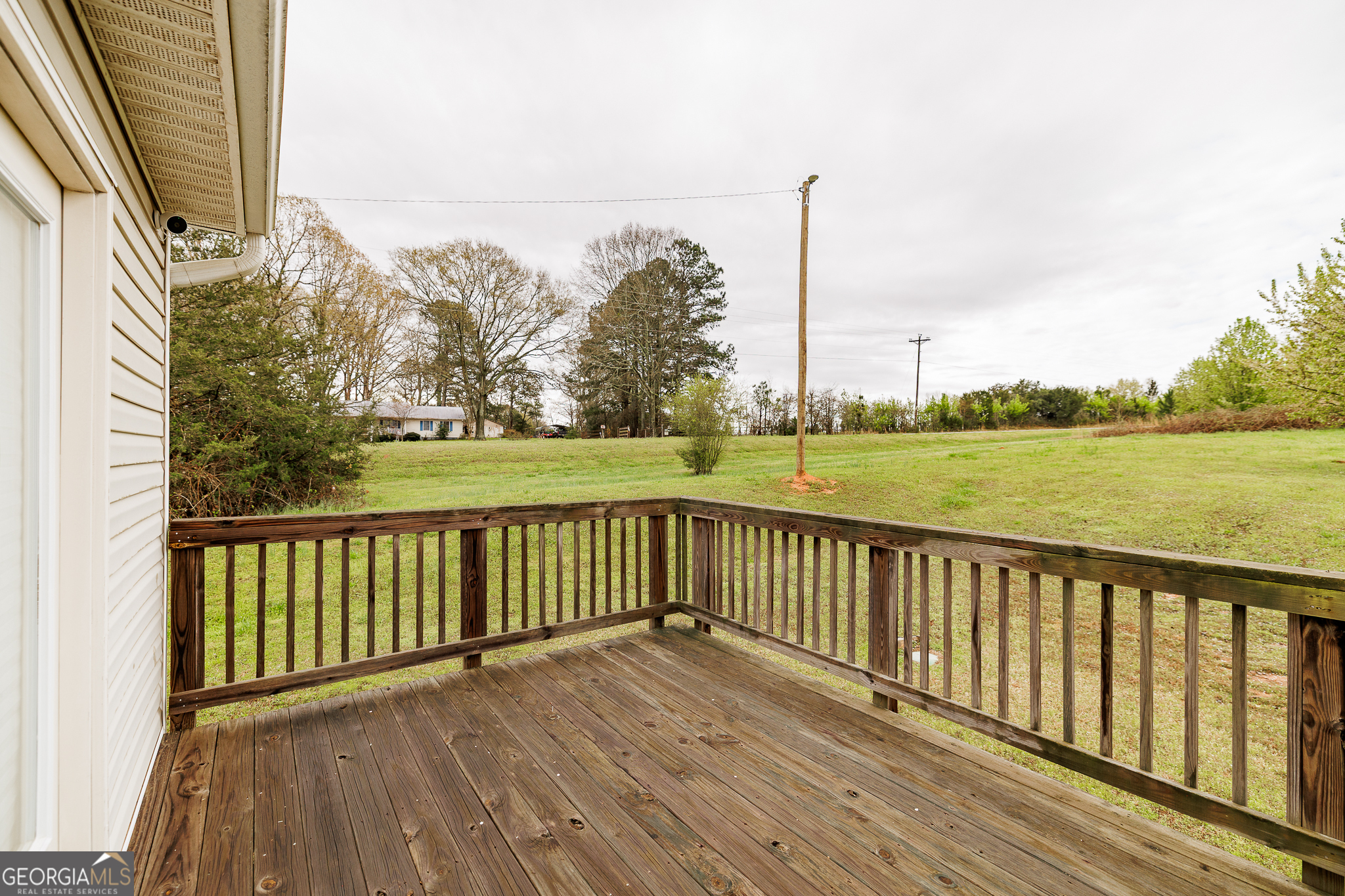 105 Stonebrooke Drive Colbert, GA 30628 - Photo 20 of 26 a view of wooden deck and city view