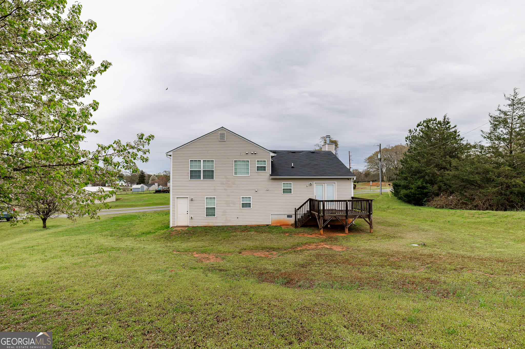 105 Stonebrooke Drive Colbert, GA 30628 - Photo 23 of 26 a view of a house with a yard and sitting area