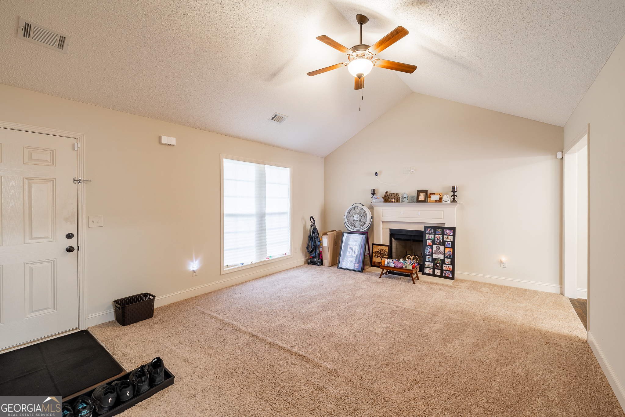 105 Stonebrooke Drive Colbert, GA 30628 - Photo 5 of 26 a view of a livingroom with a fireplace and a workspace