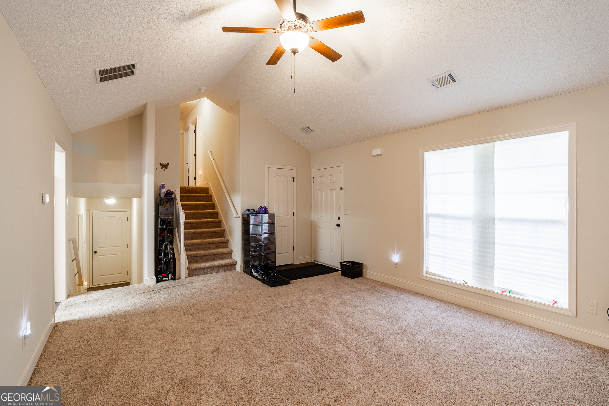 105 Stonebrooke Drive Colbert, GA 30628 - Photo 6 of 26 a view of a room with gym equipment and a window
