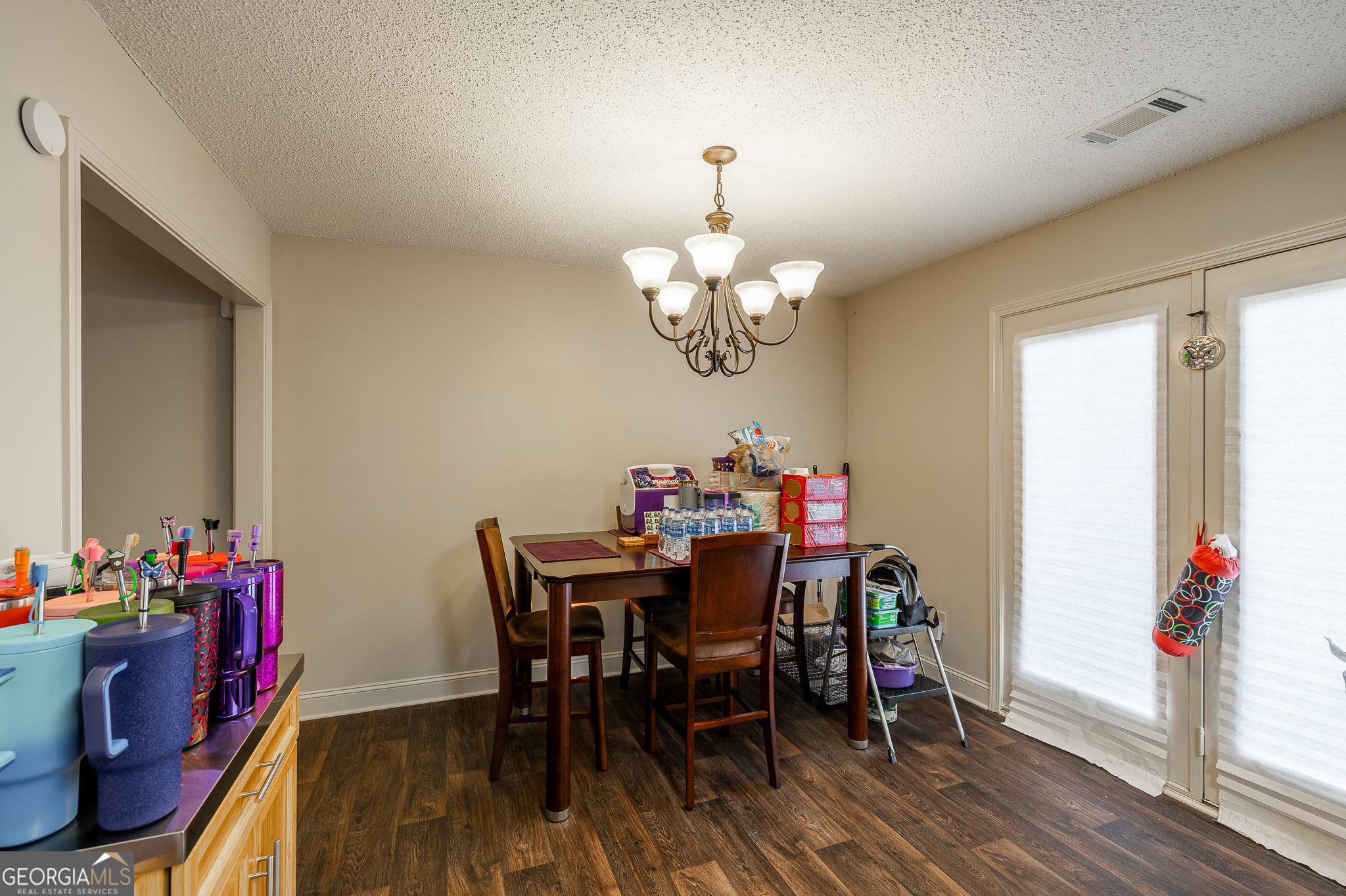 105 Stonebrooke Drive Colbert, GA 30628 - Photo 7 of 26 a view of a dining room with furniture and wooden floor