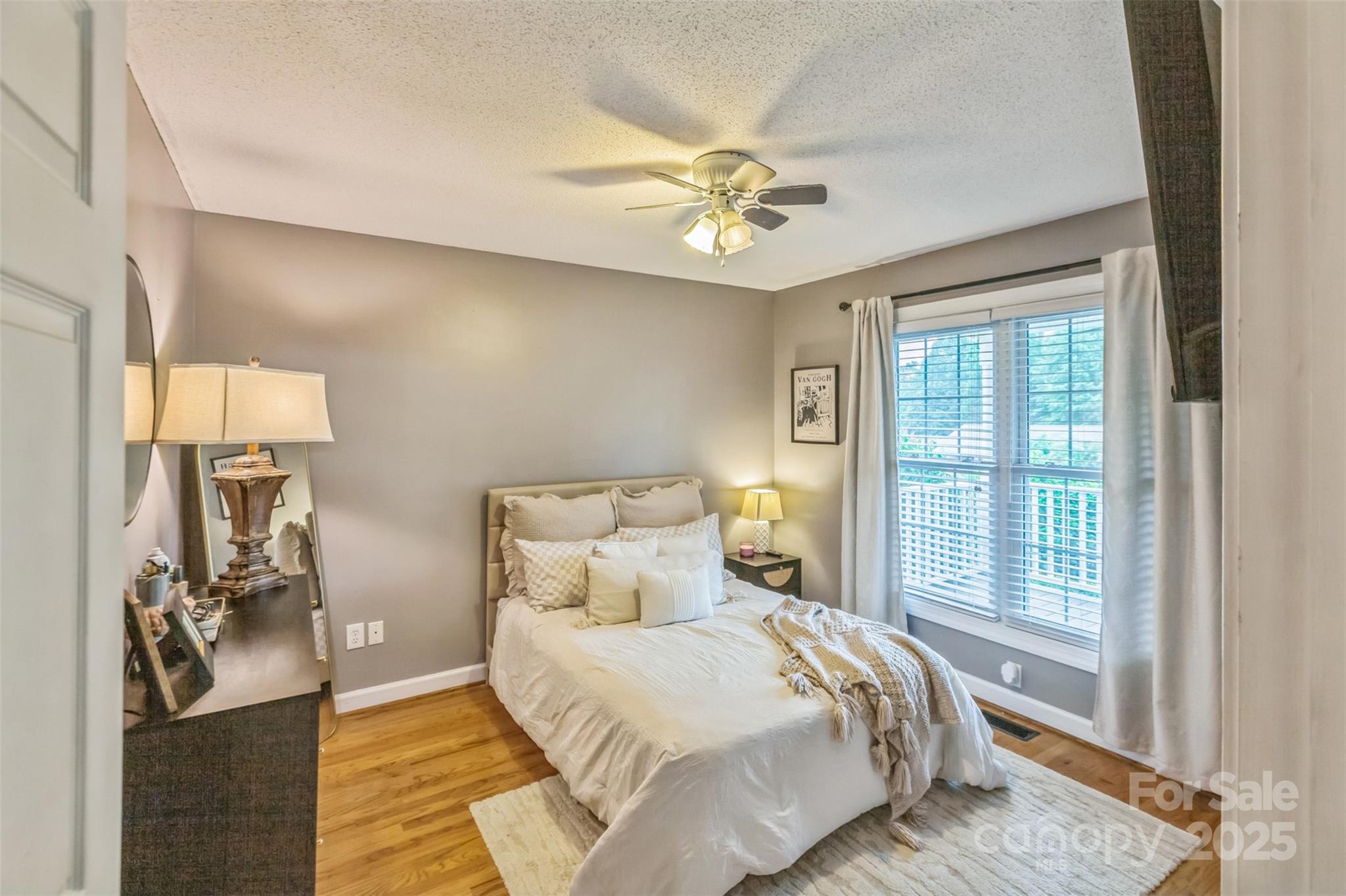 150 Marys Lane Rutherfordton, NC 28139 - Photo 14 of 35 a bedroom with a bed ceiling fan and a window