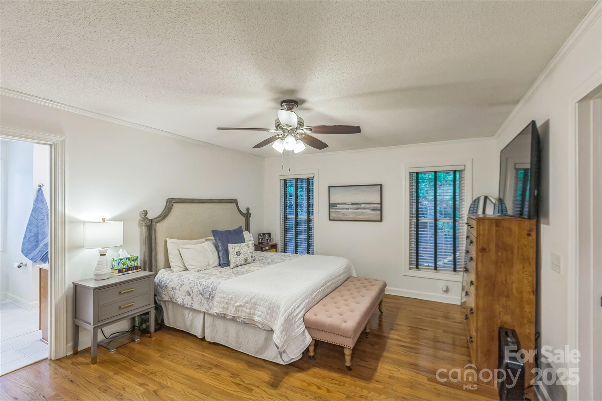 150 Marys Lane Rutherfordton, NC 28139 - Photo 16 of 35 a bedroom with a bed and a chandelier