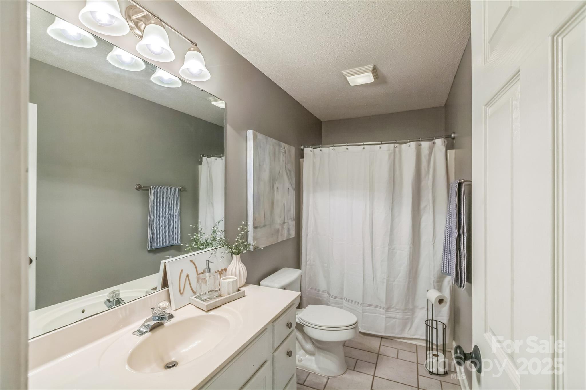 150 Marys Lane Rutherfordton, NC 28139 - Photo 21 of 35 a bathroom with a sink a toilet and shower