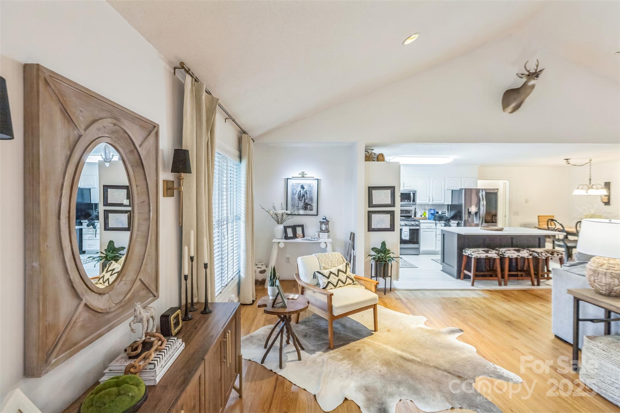 150 Marys Lane Rutherfordton, NC 28139 - Photo 5 of 35 a living room with furniture a fireplace and a potted plant