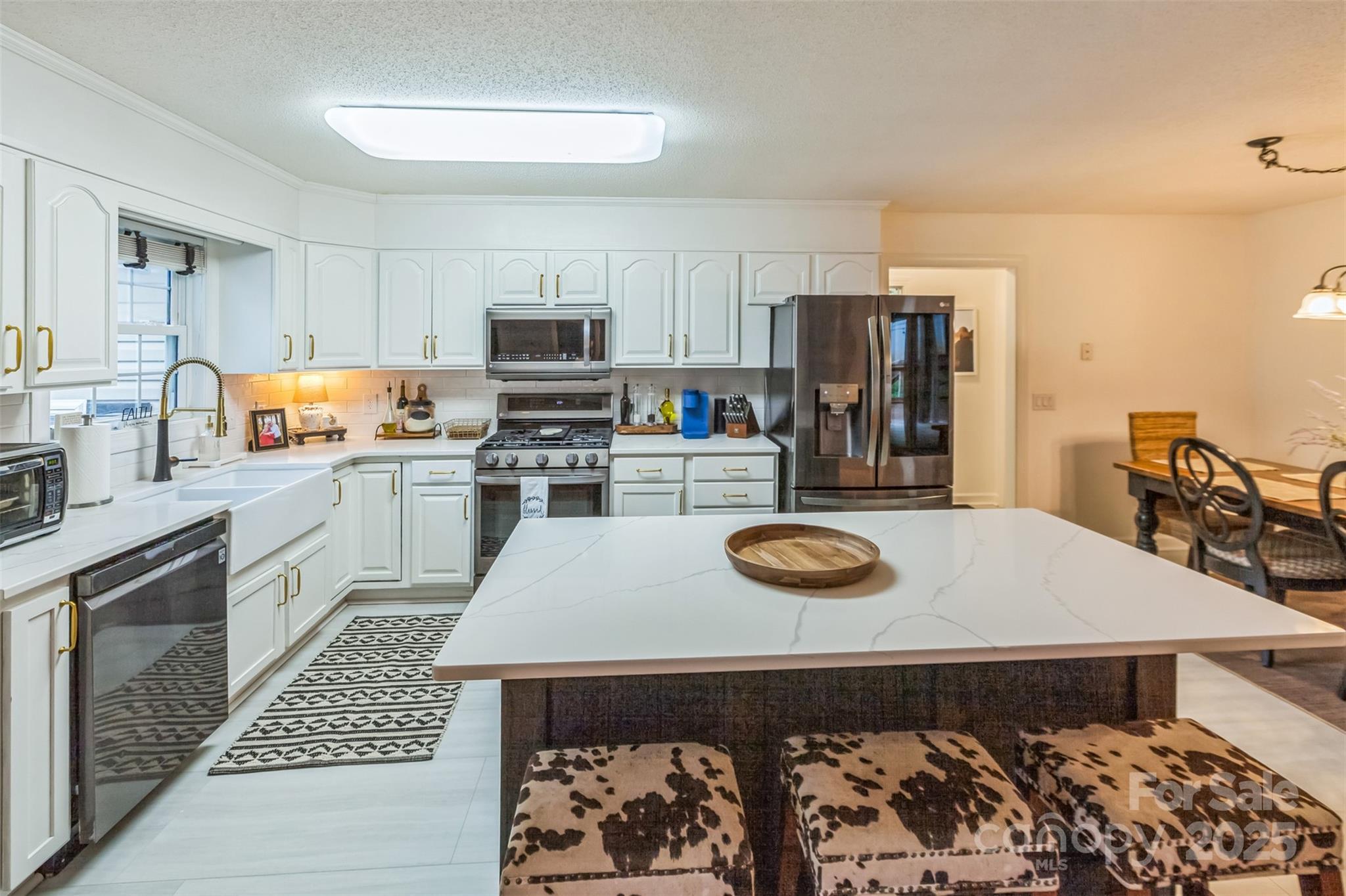 150 Marys Lane Rutherfordton, NC 28139 - Photo 10 of 35 a kitchen with stainless steel appliances a stove a sink and a refrigerator