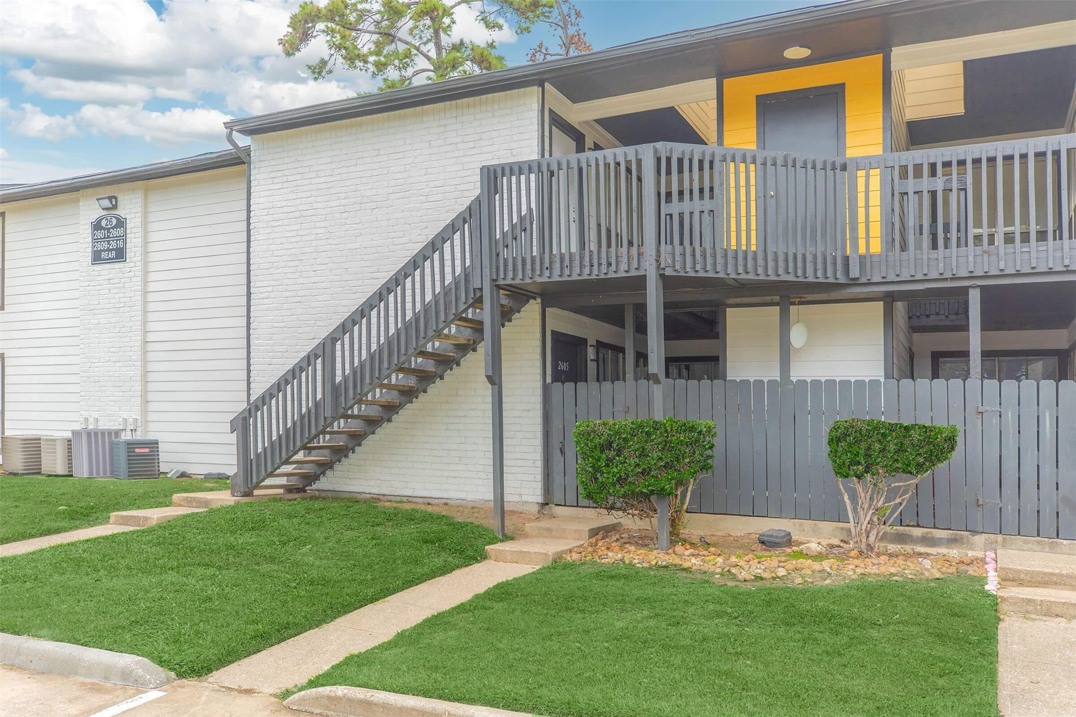 21717 Inverness Forest Boulevard, Unit 905 Houston, TX 77073 - Photo 24 of 33 a view of a house with a yard and plants