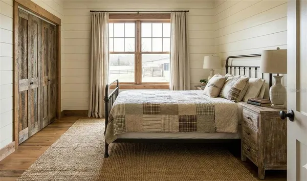a bedroom with a bed and a window
