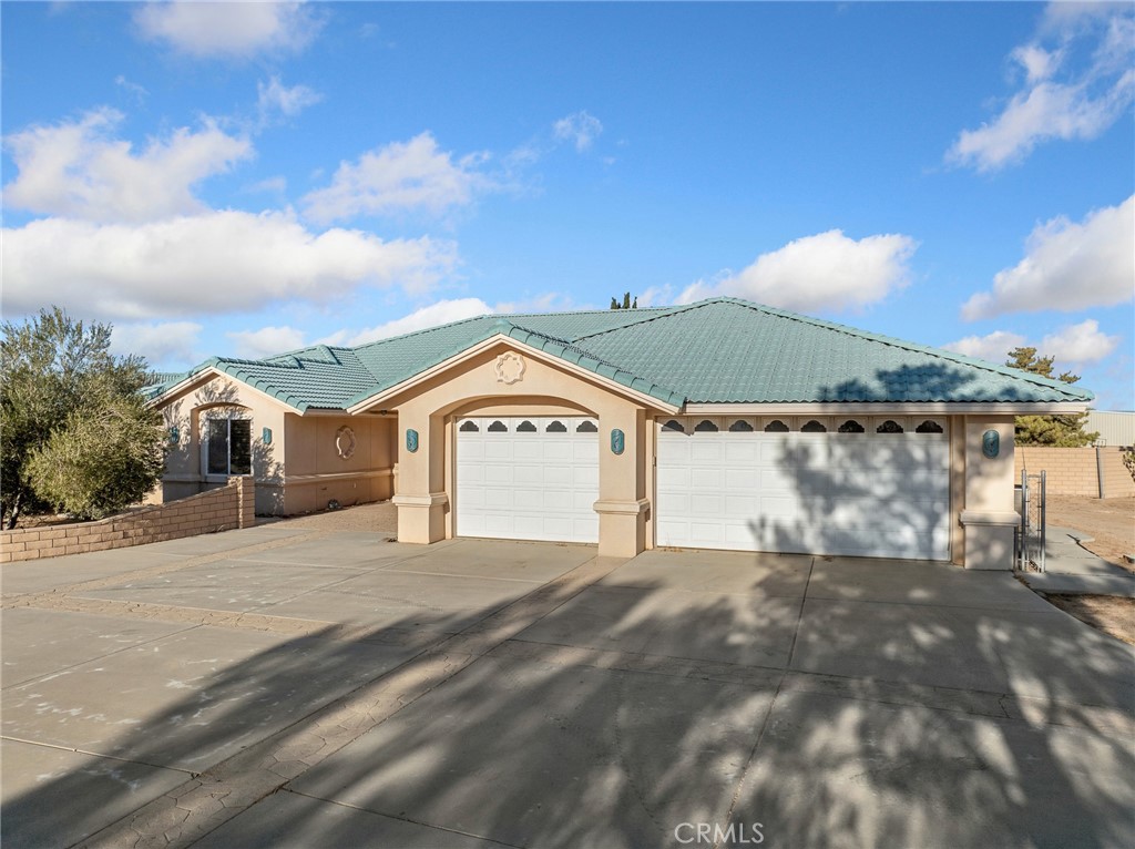 7139 Foley Road Oak Hills, CA 92344 - Photo 11 of 72 a view of a house with a yard