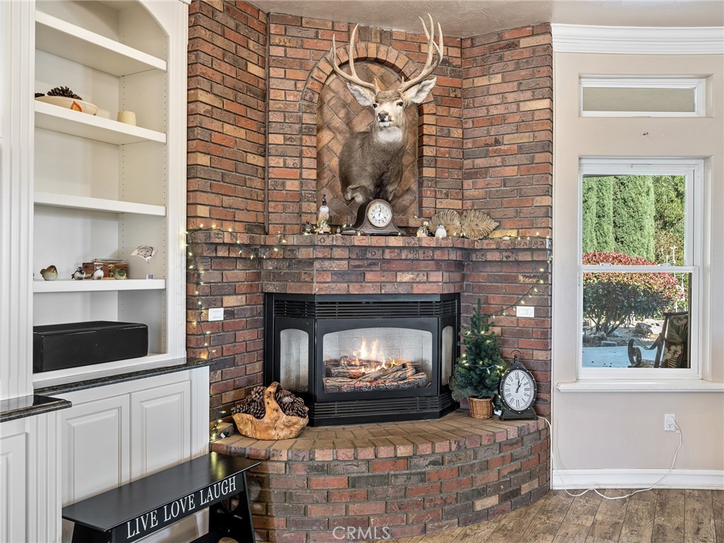 7139 Foley Road Oak Hills, CA 92344 - Photo 15 of 72 a living room with furniture and a fireplace