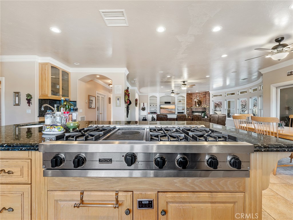 7139 Foley Road Oak Hills, CA 92344 - Photo 24 of 72 a kitchen with a stove and cabinets