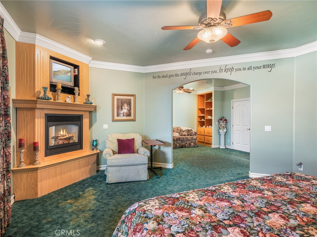 7139 Foley Road Oak Hills, CA 92344 - Photo 41 of 72 a living room with furniture and a fireplace