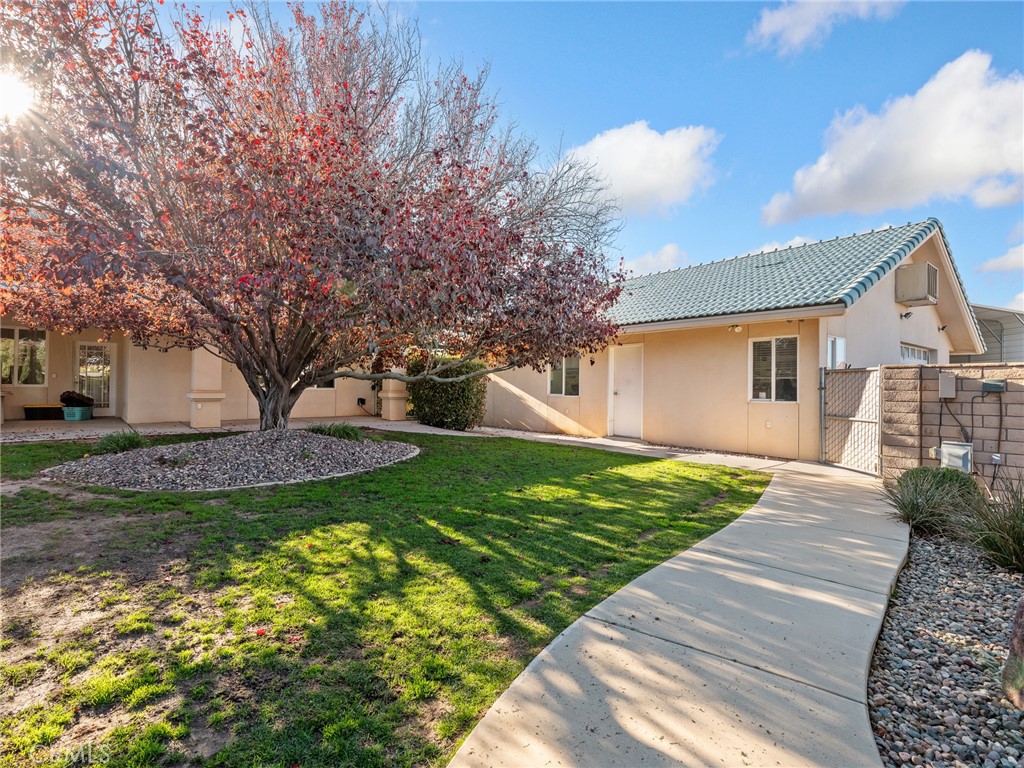 7139 Foley Road Oak Hills, CA 92344 - Photo 66 of 72 a front view of a house with garden