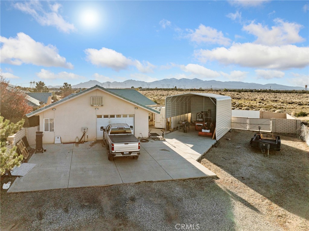 7139 Foley Road Oak Hills, CA 92344 - Photo 67 of 72 a view of a terrace with lawn chairs