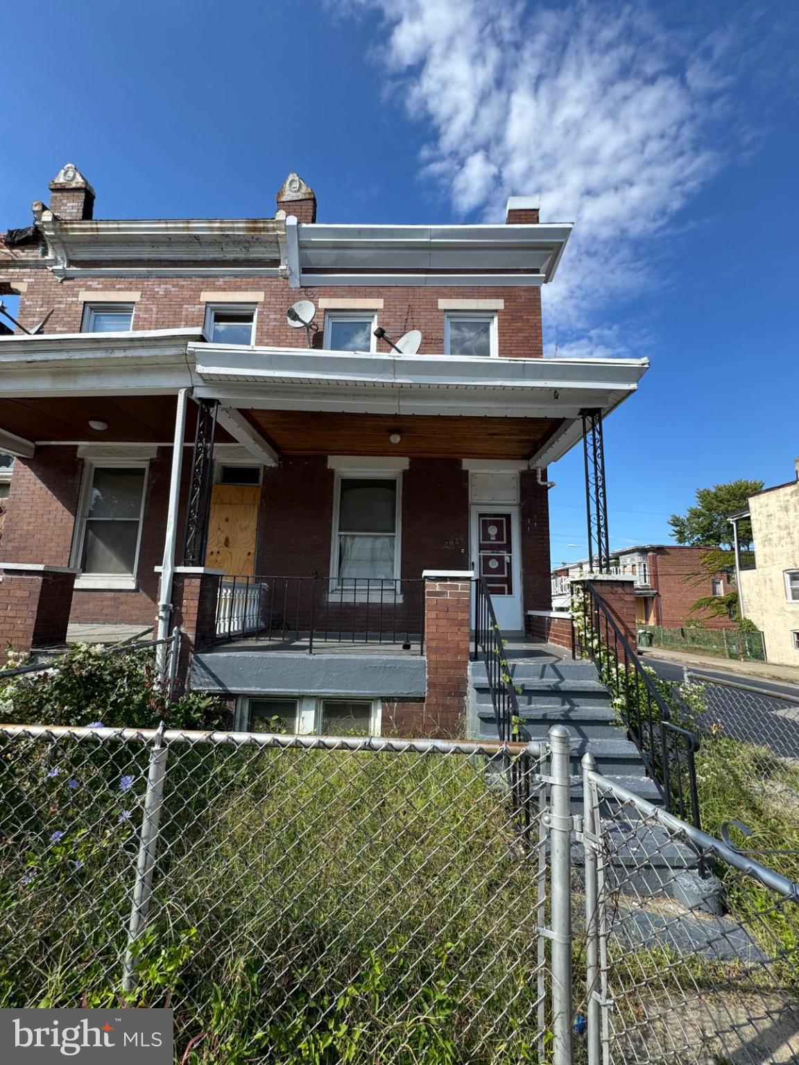 2826 Winchester Street Baltimore, MD 21216 - Photo 1 of 22 a view of a house with wooden fence