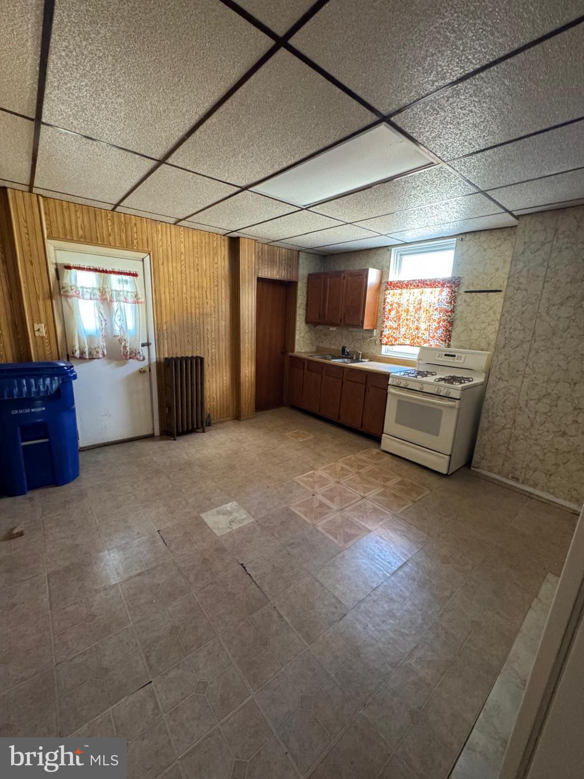 2826 Winchester Street Baltimore, MD 21216 - Photo 12 of 22 a large room with furniture and windows