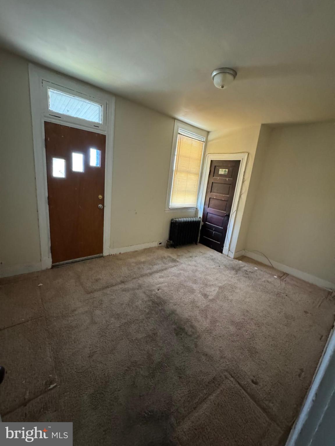 2826 Winchester Street Baltimore, MD 21216 - Photo 16 of 22 an empty room with a window