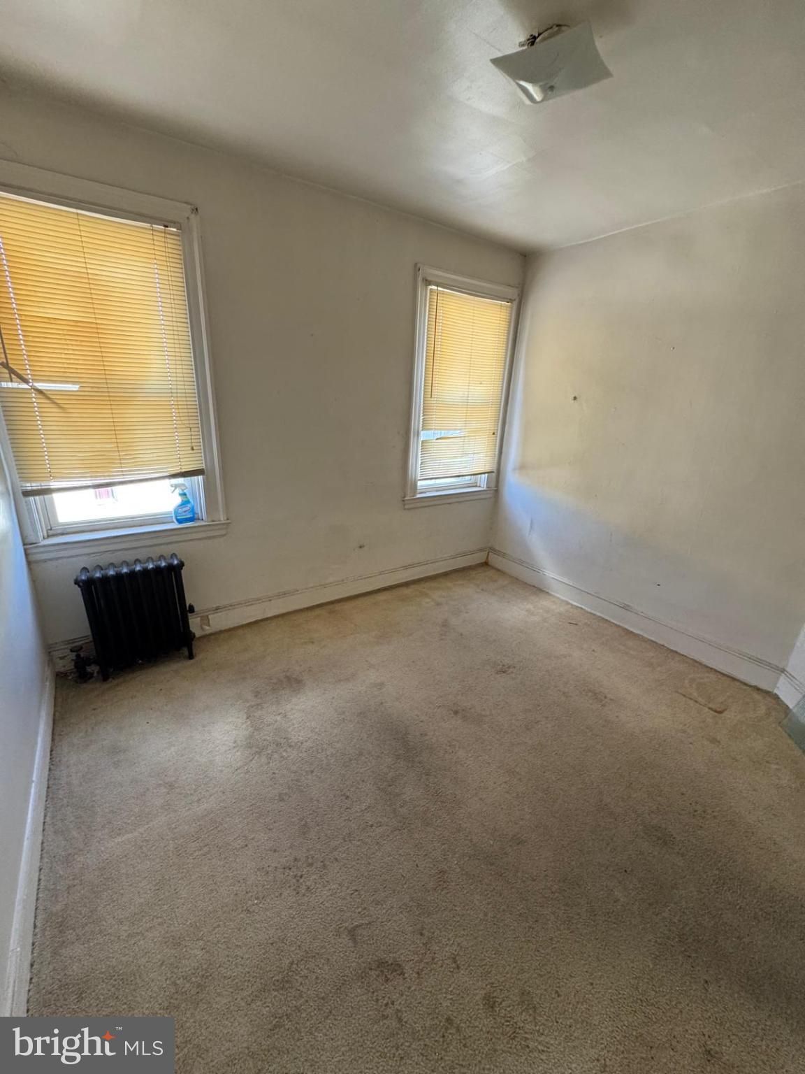 2826 Winchester Street Baltimore, MD 21216 - Photo 17 of 22 an empty room with windows