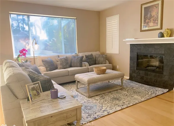 a living room with furniture and a fireplace