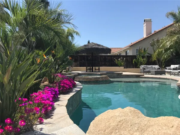 a view of swimming pool with a patio