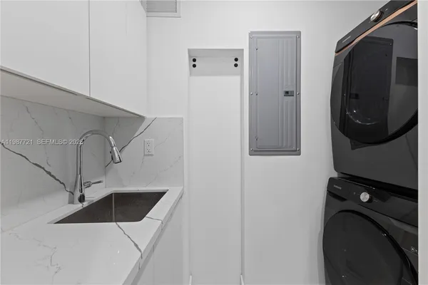 a view of a hallway with washer and dryer