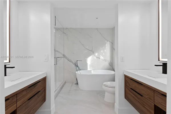 a bathroom with a sink a toilet and a bathtub