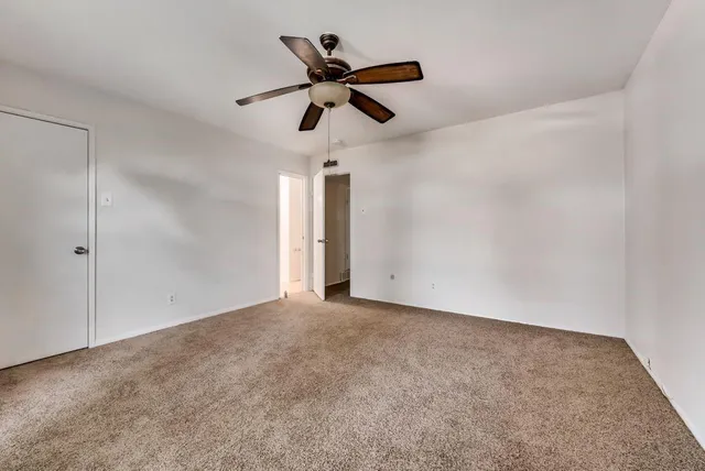 a view of room with a ceiling fan