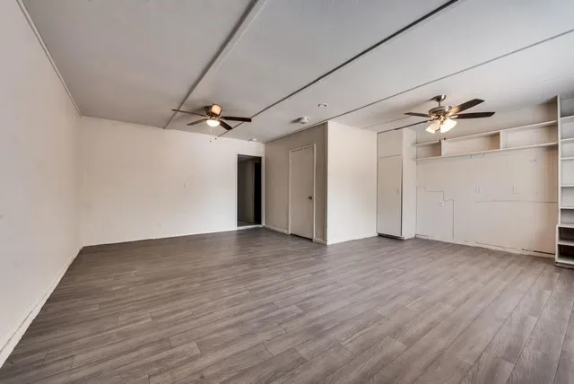 a view of a livingroom with wooden floor