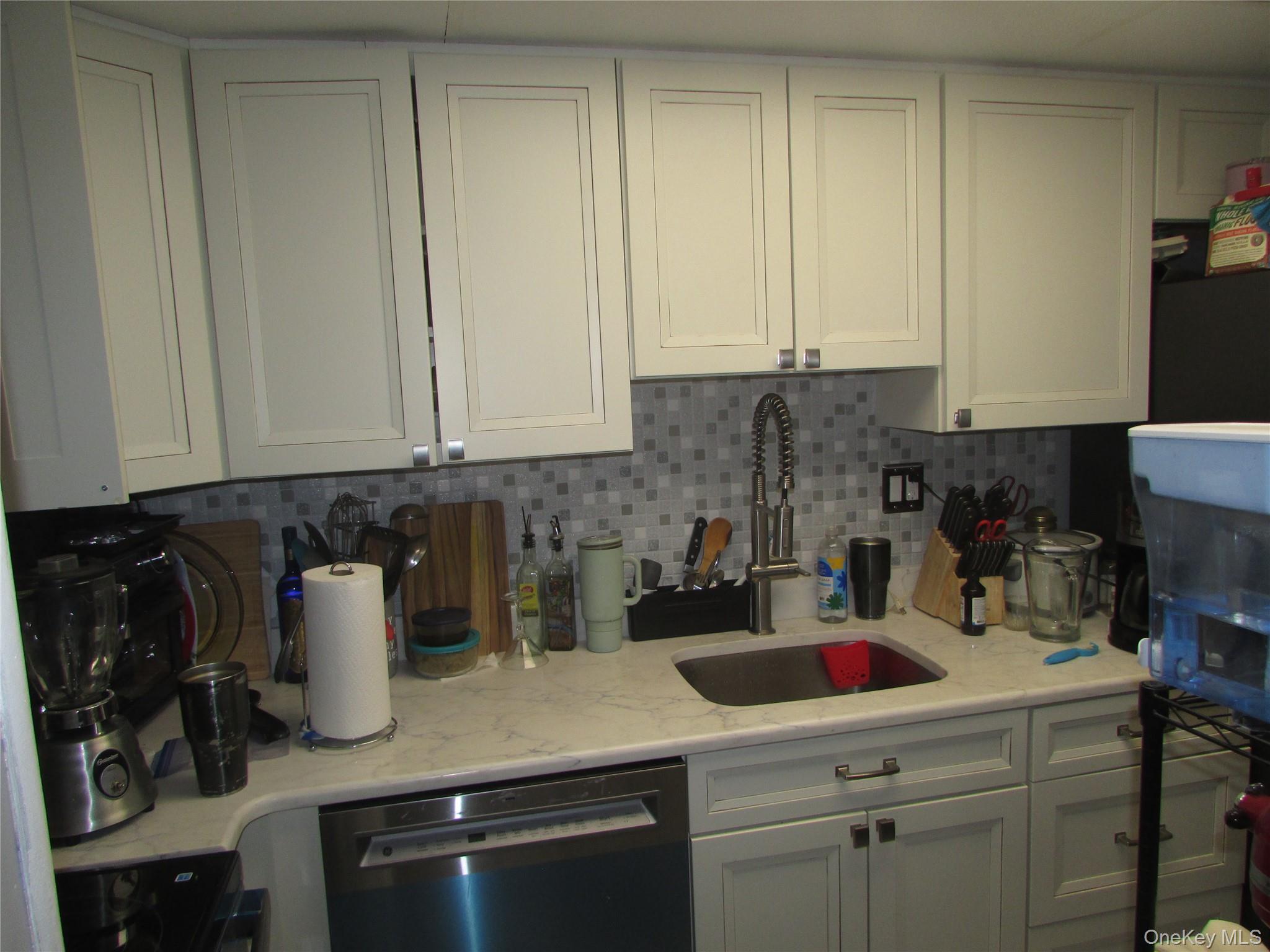 32 Hurlihe Street, Unit C Poughkeepsie, NY 12601 - Photo 2 of 8 a kitchen with a sink and cabinets