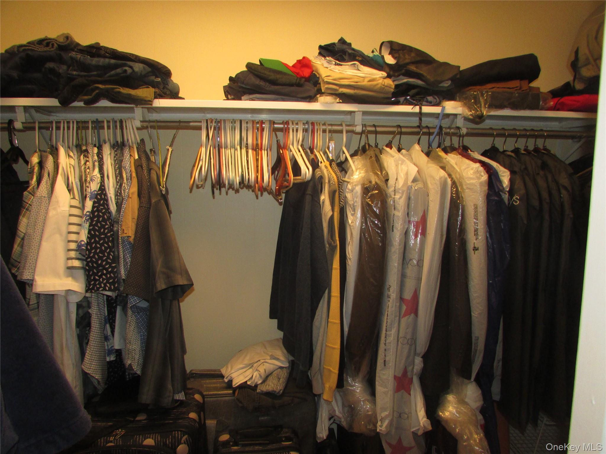 32 Hurlihe Street, Unit C Poughkeepsie, NY 12601 - Photo 6 of 8 a view of walk in closet with clothes and shoes