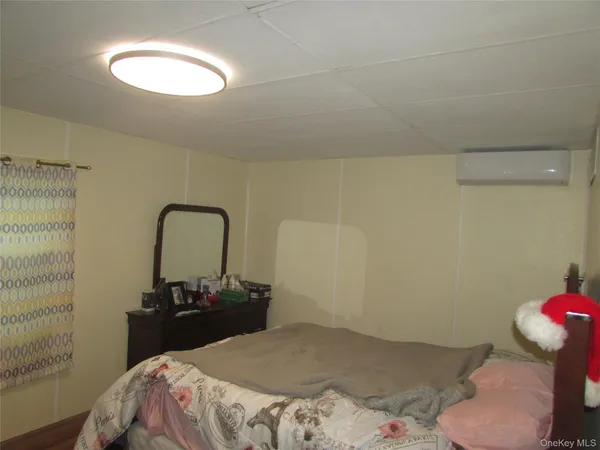 a bedroom with a bed and a bathroom