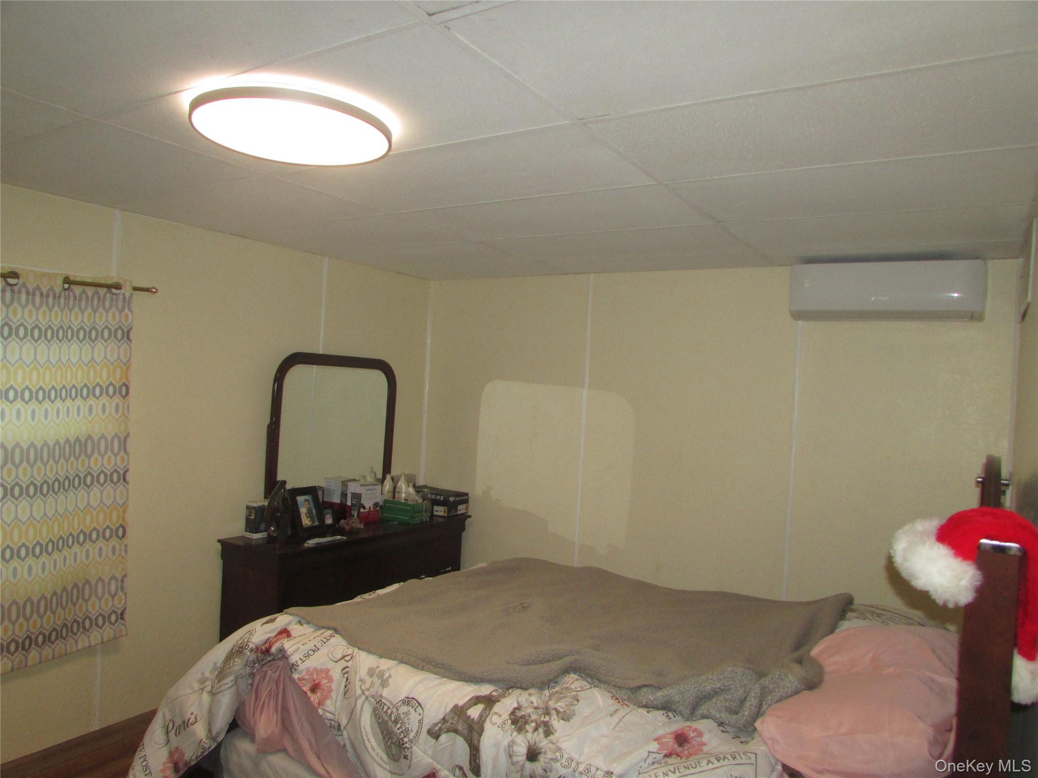 32 Hurlihe Street, Unit C Poughkeepsie, NY 12601 - Photo 8 of 8 a bedroom with a bed and a bathroom