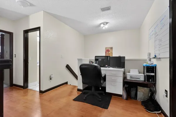 a bedroom with a bed window and a mirror
