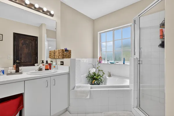 a bathroom with a tub and a shower