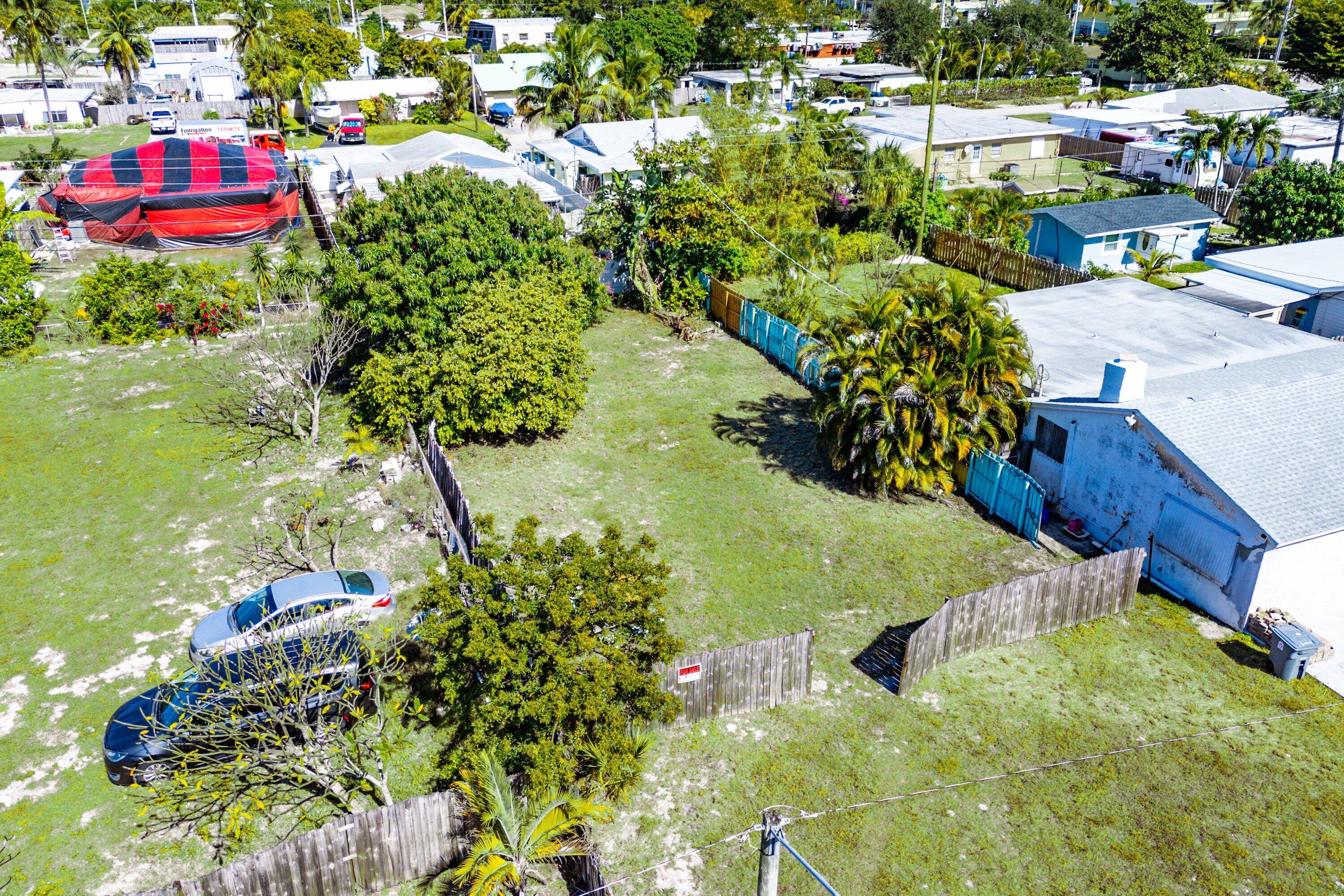 1073 Florence Road Lake Worth, FL 33462 - Photo 2 of 12 a view of a lake with a house