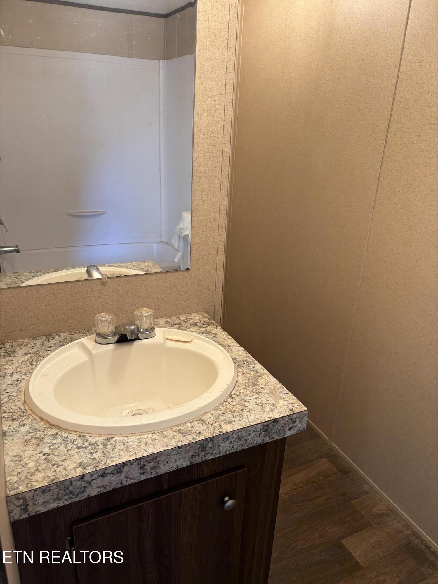 106 Swafford Road Spring City, TN 37381 - Photo 11 of 19 a bathroom with a granite countertop sink and a mirror