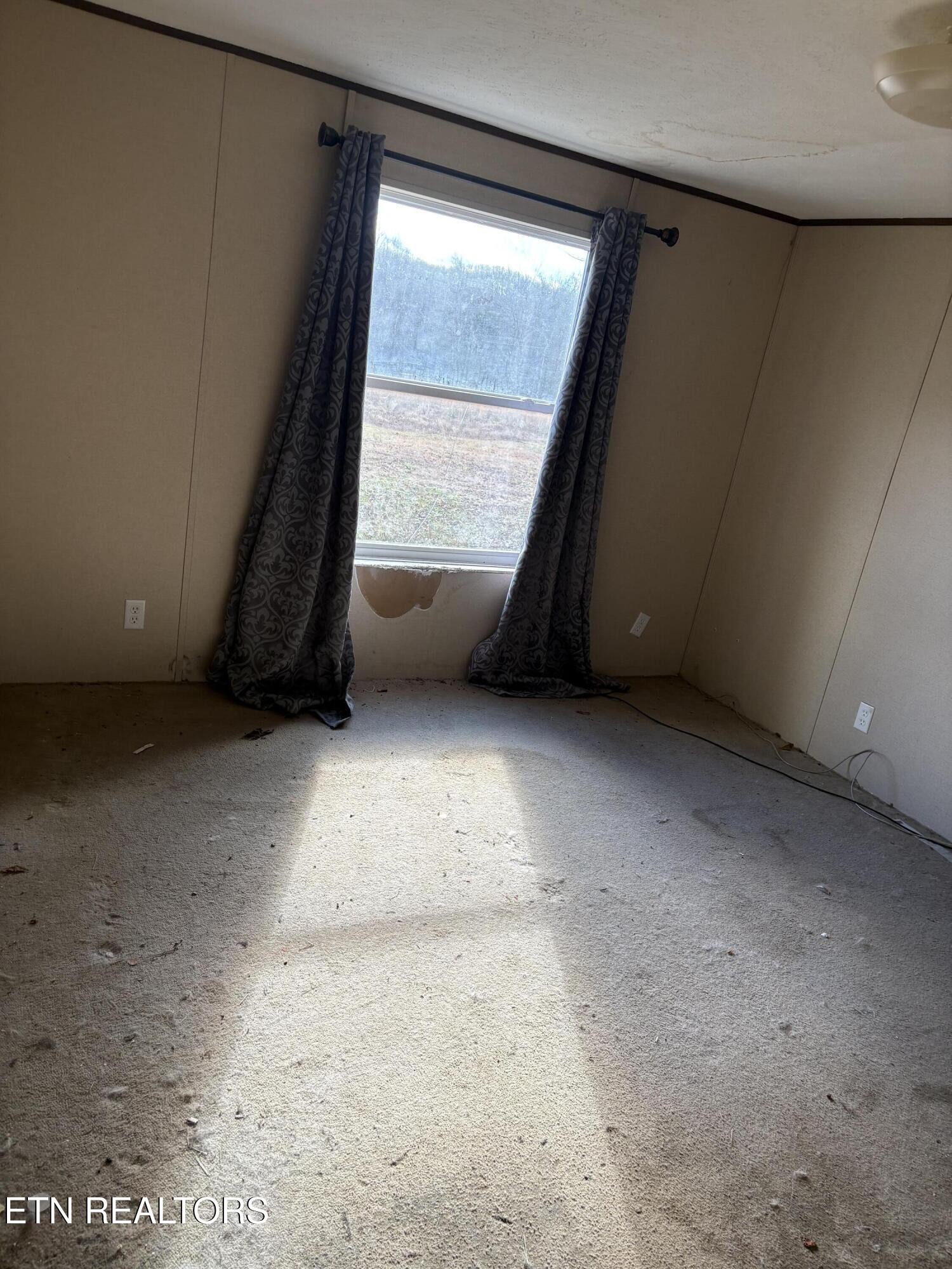 106 Swafford Road Spring City, TN 37381 - Photo 12 of 19 an empty room with a window
