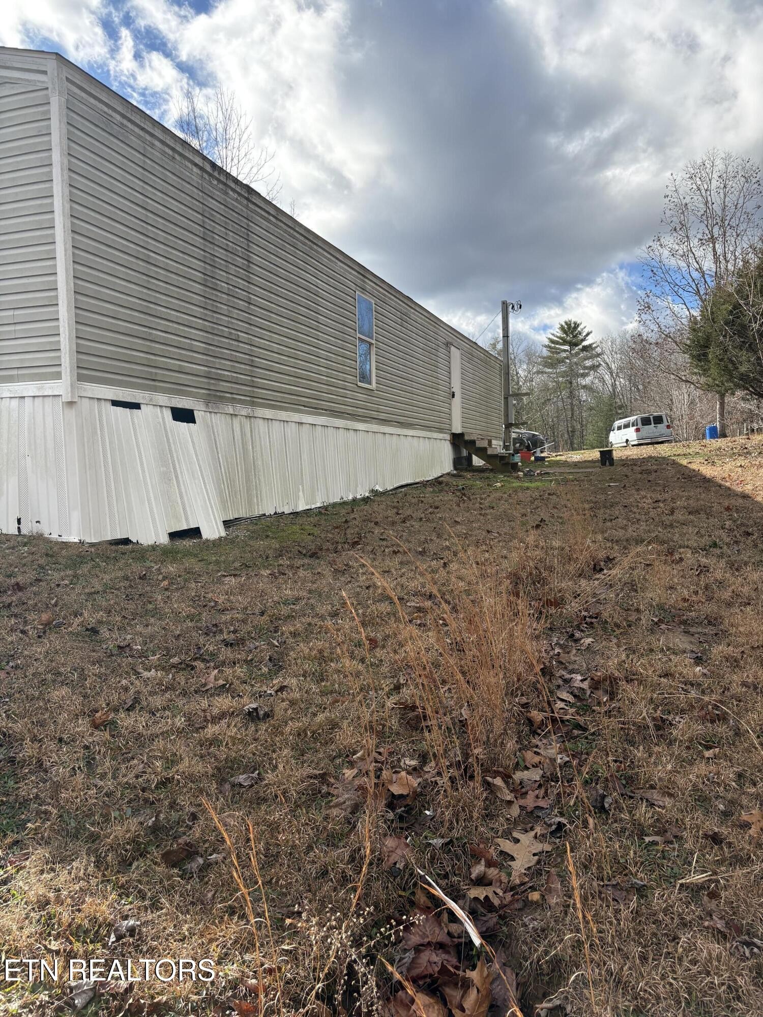 106 Swafford Road Spring City, TN 37381 - Photo 2 of 19 a view of a backyard of the house