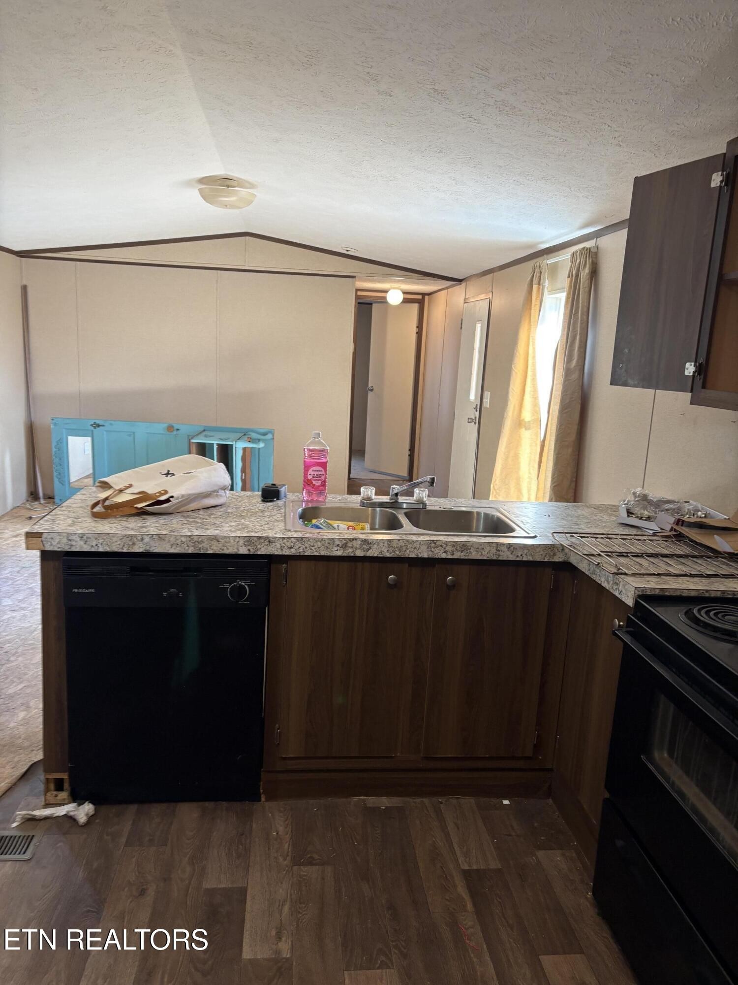 106 Swafford Road Spring City, TN 37381 - Photo 7 of 19 a room with a stove a sink and a microwave