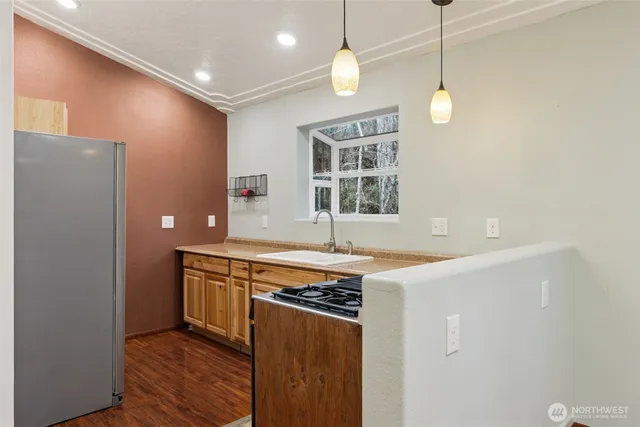 a kitchen with a stove and a shower
