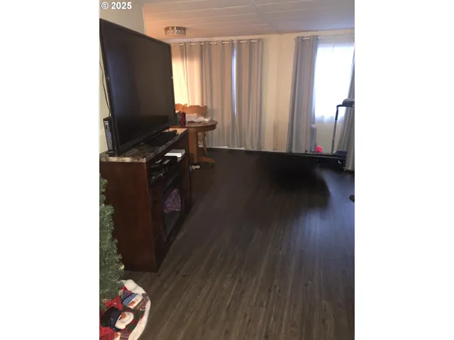 a view of workspace with wooden floor and air conditioner